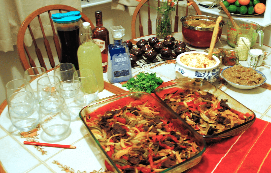 Food for a crowd. The wax pencil takes the place of wine charms. You can write your name on the glasses, and it will wash off later.
