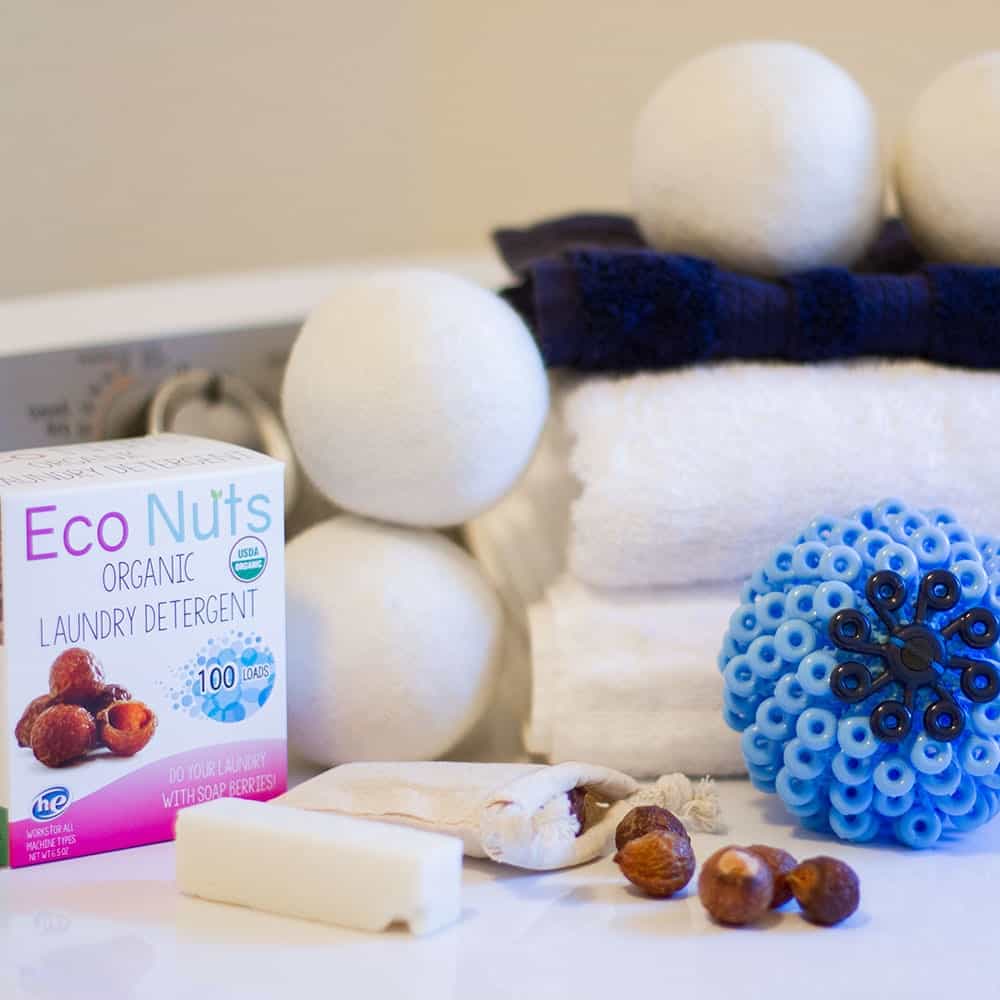 earth hero laundry basket including a cora ball, soapnuts, towels, and wool dryer balls | organic, all natural, eco friendly